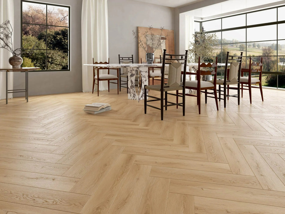 Canadian Standard Akita 12mm waterproof laminate flooring arranged in a classic herringbone pattern with realistic textured wood grain applied in a dining room