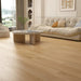Canadian Standard Akita 12mm waterproof laminate flooring in a wide straight plank format with realistic wood grain texture applied in a living room