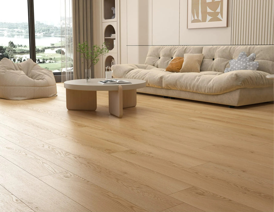 Canadian Standard Akita 12mm waterproof laminate flooring in a wide straight plank format with realistic wood grain texture applied in a living room