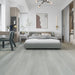 Canadian Standard Dawson Vanntett Plus 7mm waterproof SPC vinyl flooring featuring wide wood-look planks with realistic textured grain and a matte finish applied in a bedroom