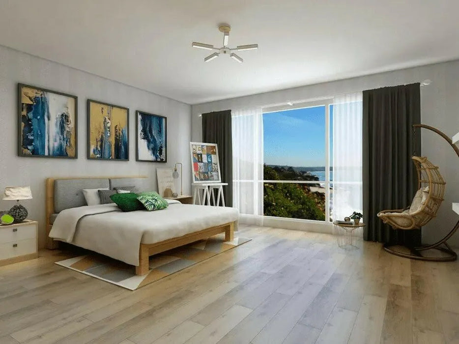 Canadian Standard EGGER PRO Light Nakina Oak 12mm laminate flooring featuring 7.6-inch wide planks with natural oak-look wood grain applied in a bedroom