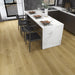 Canadian Standard Nara Elemental12 waterproof laminate flooring featuring wide 9.29-inch wood-look planks with realistic grain and textured finish in a dining room
