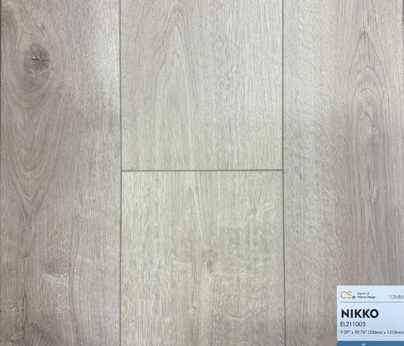 Canadian Standard Nikko Elemental12 waterproof laminate flooring featuring wide 9.29-inch wood-look planks with realistic grain and textured finish