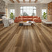 Canadian Standard Uji Elemental12 waterproof laminate flooring featuring wide 9.29-inch wood-look planks with realistic grain and textured finish in a living room