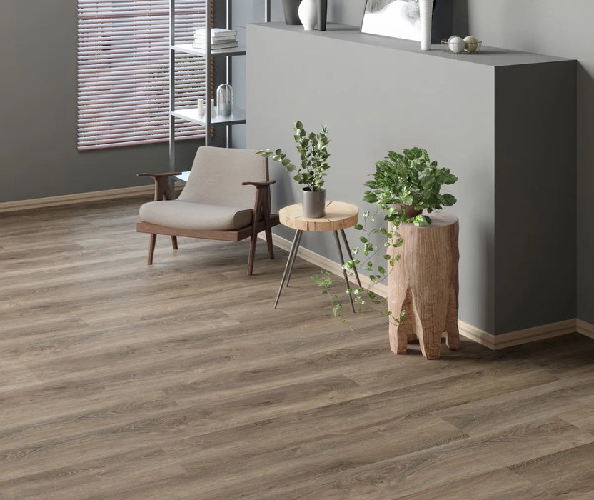 Canadian Standard Inhaus Elandura Caraway waterproof rigid core vinyl flooring featuring grey wood-look grain, medium colour variation and 6.81-inch-wide planks in a room scene