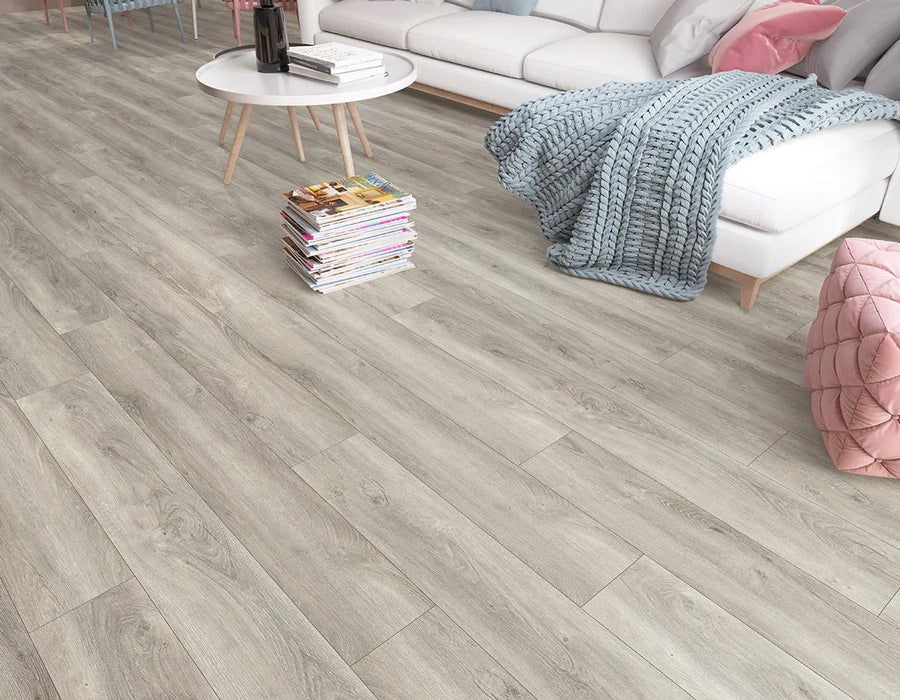 Canadian Standard Inhaus Elandura Clove 5mm waterproof rigid core vinyl flooring featuring medium taupe oak-look grain with medium tonal variation in a living room