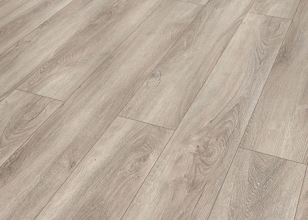 Canadian Standard Inhaus Elandura Clove 5mm waterproof rigid core vinyl flooring featuring medium taupe oak-look grain with medium tonal variation plank details closeup