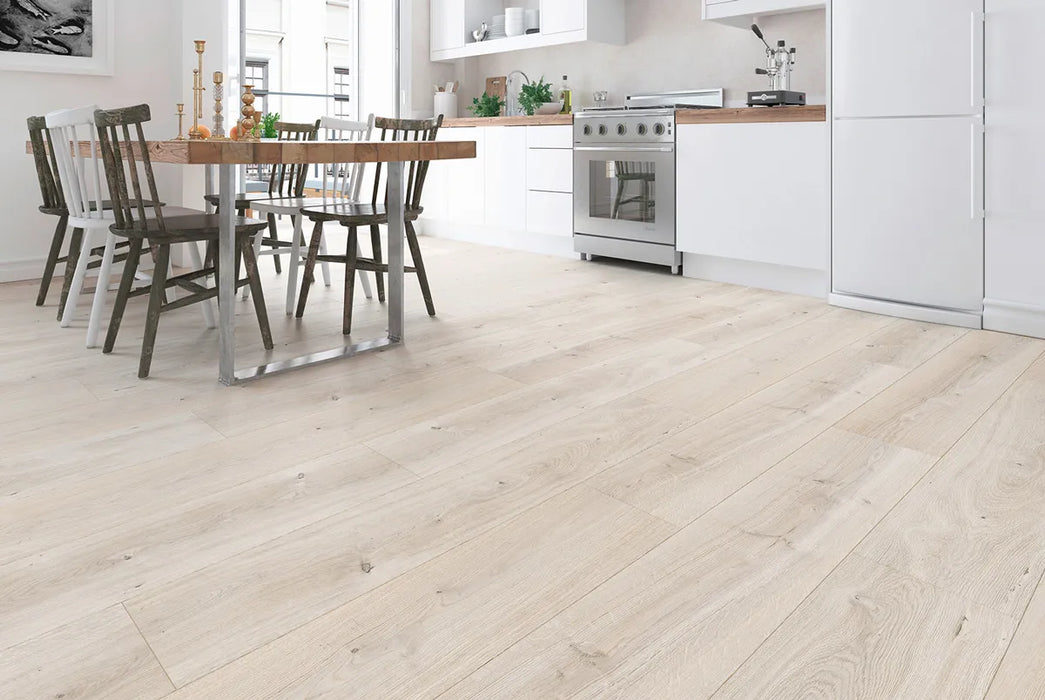 Canadian Standard Inhaus Elandura Seaside 5mm waterproof rigid core vinyl flooring featuring light white-toned wood grain with subtle tonal variation in a dining room and kitchen