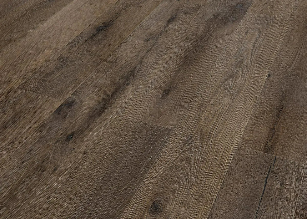 Canadian Standard Inhaus Elandura Terra 5mm waterproof rigid core vinyl flooring featuring dark brown oak-look grain with medium tonal variation plank detail closeup
