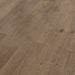 Canadian Standard Inhaus Elandura Tuscan 5mm waterproof rigid core vinyl flooring featuring dark brown wood-look grain with medium tonal variation plank detail closeup