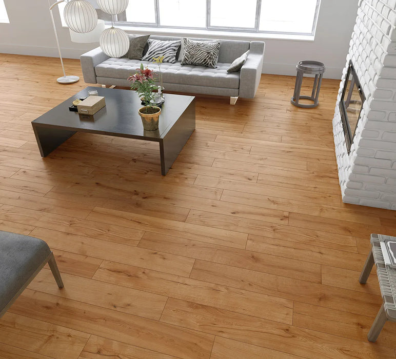 Canadian Standard Inhaus Elandura Umber 5mm waterproof rigid core vinyl flooring featuring medium russet wood-look grain with light tonal variation in a living room