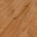 Canadian Standard Inhaus Elandura Umber 5mm waterproof rigid core vinyl flooring featuring medium russet wood-look grain with light tonal variation plank details closeup