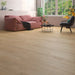 Canadian Standard Inhaus Elandura Urban 5mm waterproof rigid core vinyl flooring featuring light beige wood-look grain with subtle tonal variation in a living room