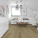 Canadian Standard Inhaus Elandura Woodwind 5mm waterproof rigid core vinyl flooring featuring medium brown wood-look grain with light tonal variation in a living room