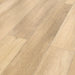 Canadian Standard Inhaus Inspiration Lamdura Edgewood 10mm water-resistant laminate flooring featuring light blonde oak-look grain and 7.56-inch-wide planks detail closeup