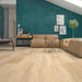 Canadian Standard Inhaus Inspiration Lamdura Edgewood 10mm water-resistant laminate flooring featuring light blonde oak-look grain and 7.56-inch-wide planks in a living room