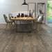 Canadian Standard Inhaus Inspiration Lamdura Folkstone 8mm water-resistant laminate flooring with handscraped embossed-in-register wood-grain texture in a dining room
