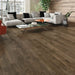 Canadian Standard Inhaus Inspiration Lamdura Grizzly 10mm water-resistant laminate flooring featuring handscraped wood-look planks and 2mm attached pad in a living room