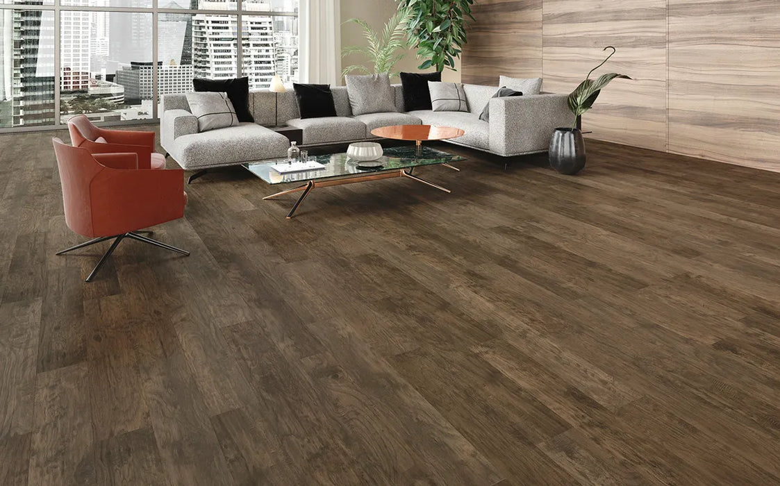 Canadian Standard Inhaus Inspiration Lamdura Grizzly 8mm water-resistant laminate flooring featuring handscraped wood-grain detailing in a living room