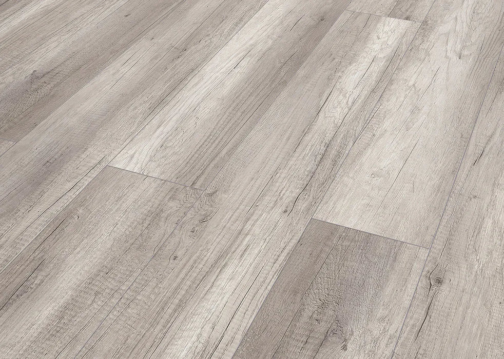 Canadian Standard Inhaus Inspiration Lamdura Oak Light Grey 10mm water-resistant laminate flooring with light grey oak-look grain and attached acoustic pad plank details