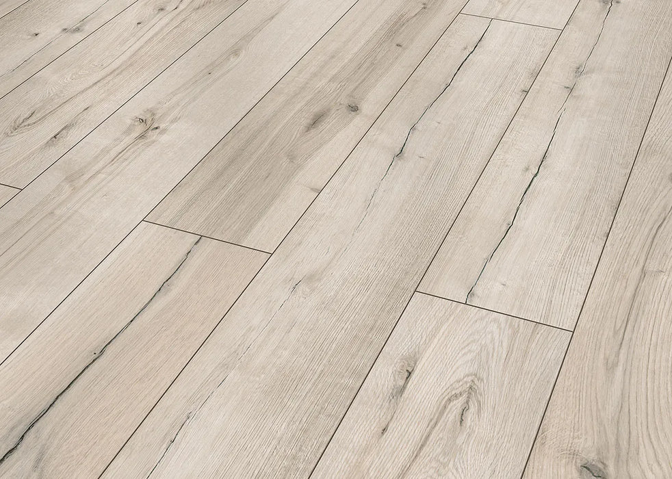 Canadian Standard Inhaus Inspiration Lamdura Sedgwick 10mm water-resistant laminate flooring featuring natural wood-look grain and 2mm attached pad plank details