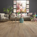 Canadian Standard Inhaus Inspiration Lamdura Selkirk 8mm water-resistant laminate flooring featuring natural wood-look grain and 7.56-inch-wide planks in a living room
