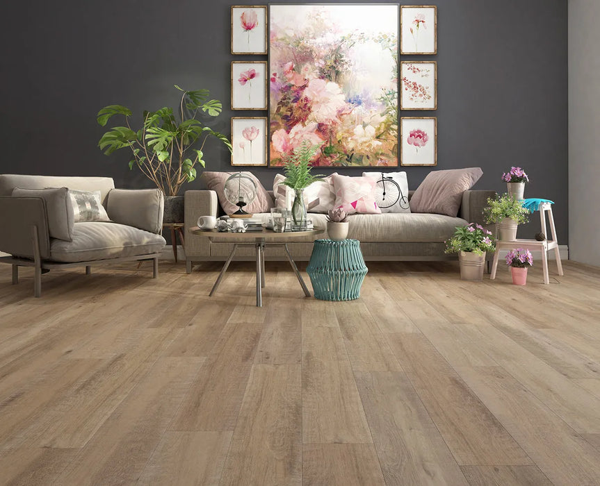 Canadian Standard Inhaus Inspiration Lamdura Selkirk 8mm water-resistant laminate flooring featuring natural wood-look grain and 7.56-inch-wide planks in a living room