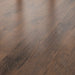 Canadian Standard Inhaus Inspiration Lamdura Tisdale 10mm water-resistant laminate flooring featuring handscraped wood-grain texture and attached pad plank details