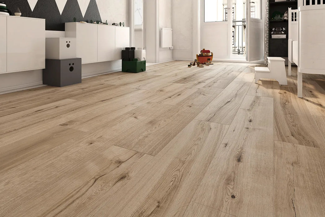 Canadian Standard Inhaus Inspiration Lamdura Woodside 10mm water-resistant laminate flooring with natural wood-look grain and 2mm attached acoustic pad in a room scene