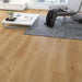 Canadian Standard Nagasaki Elemental12 waterproof laminate flooring featuring wide 9.29-inch wood-look planks with realistic grain and textured finish applied in a living room
