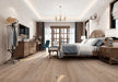 Canadian Standard Origins XL Carissa Oak engineered hardwood flooring featuring 7.5-inch wide planks with lightly handscraped and wirebrushed texture in a bedroom