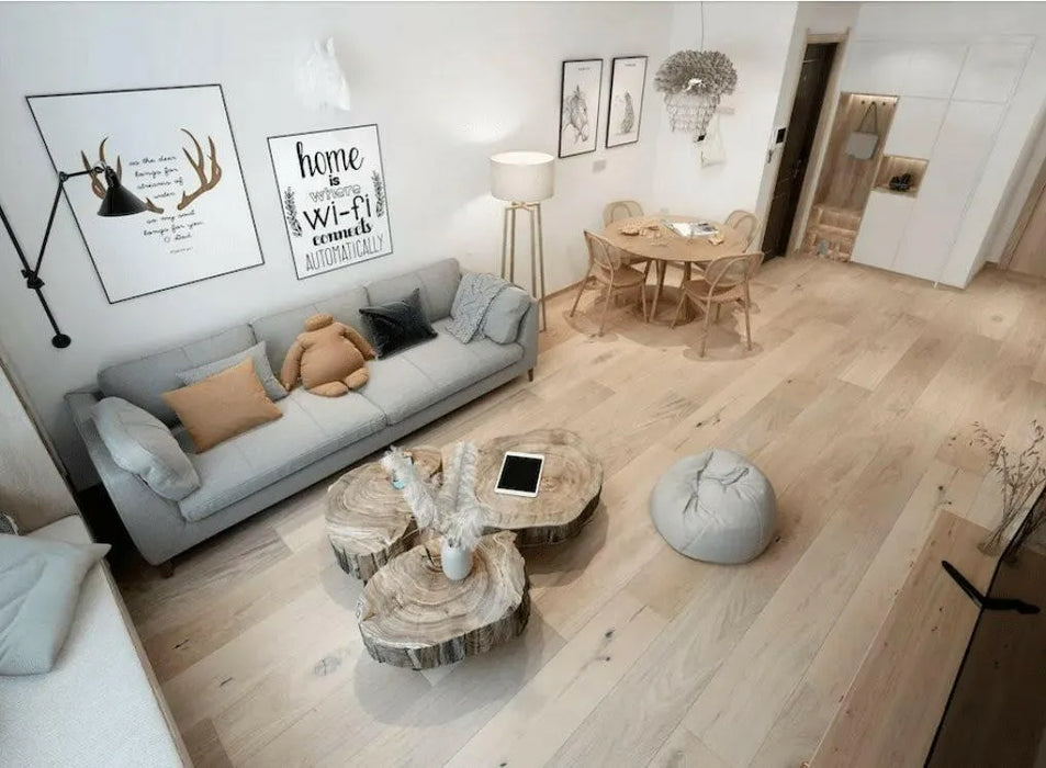 Canadian Standard Origins XL Carissa Oak engineered hardwood flooring featuring 7.5-inch wide planks with lightly handscraped and wirebrushed texture in a living room