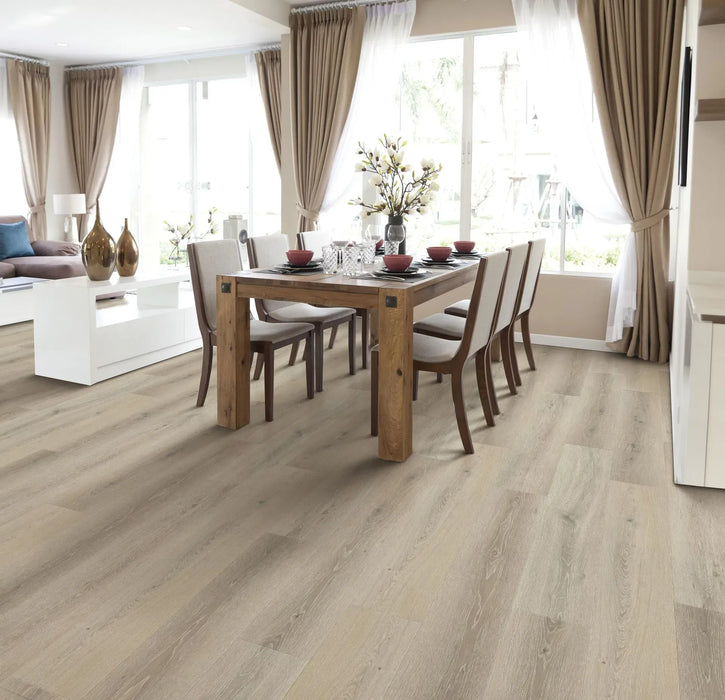 Canadian Standard Ridgecrest Lake View 8mm waterproof laminate flooring with 7.72-inch-wide planks, matte finish and natural wood-inspired grain in a dining room