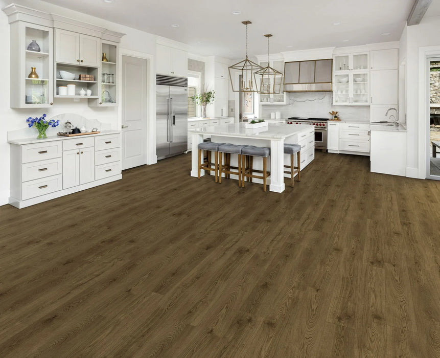 Canadian Standard Ridgecrest Oak Bridge 8mm waterproof laminate flooring with 7.72-inch-wide planks, matte finish and authentic wood-inspired plank pattern applied in a kitchen