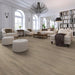 Canadian Standard Ridgecrest Willow Creek 8mm waterproof laminate flooring with 7.72-inch-wide planks, matte finish and natural-looking wood grain in a living room