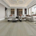Canadian Standard Ellis Vanntett Plus 7mm waterproof SPC luxury vinyl plank flooring featuring wide wood-look planks with realistic textured grain and a matte finish in a living room