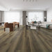 Canadian Standard Ernest Vanntett Plus 7mm waterproof SPC luxury vinyl plank flooring featuring wide wood-look planks with realistic textured grain and a matte finish in a living room
