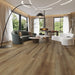 Canadian Standard Lesley Vanntett Plus 7mm waterproof SPC luxury vinyl plank flooring featuring wide wood-look planks with realistic textured grain and a matte finish in a living room