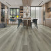 Canadian Standard Nadine Vanntett Plus 7mm waterproof SPC luxury vinyl plank flooring featuring wide wood-look planks with realistic textured grain and a matte finish in a dining room