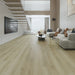 Canadian Standard Phoebe Vanntett Plus 7mm waterproof SPC luxury vinyl plank flooring featuring wide wood-look planks with realistic textured grain and a matte finish in a living room