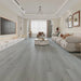 Canadian Standard Ross Vanntett Plus 7mm waterproof SPC luxury vinyl plank flooring featuring wide wood-look planks with realistic textured grain and a matte finish in a living room