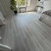NAF AquaPlus Classic Punta Cana 7mm waterproof rigid core vinyl plank flooring with textured finish and click-lock installation applied in a bedroom