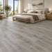 NAF AquaPlus Classic Santorini 7mm waterproof rigid core vinyl plank flooring with textured finish and click-lock installation applied in a bedroom