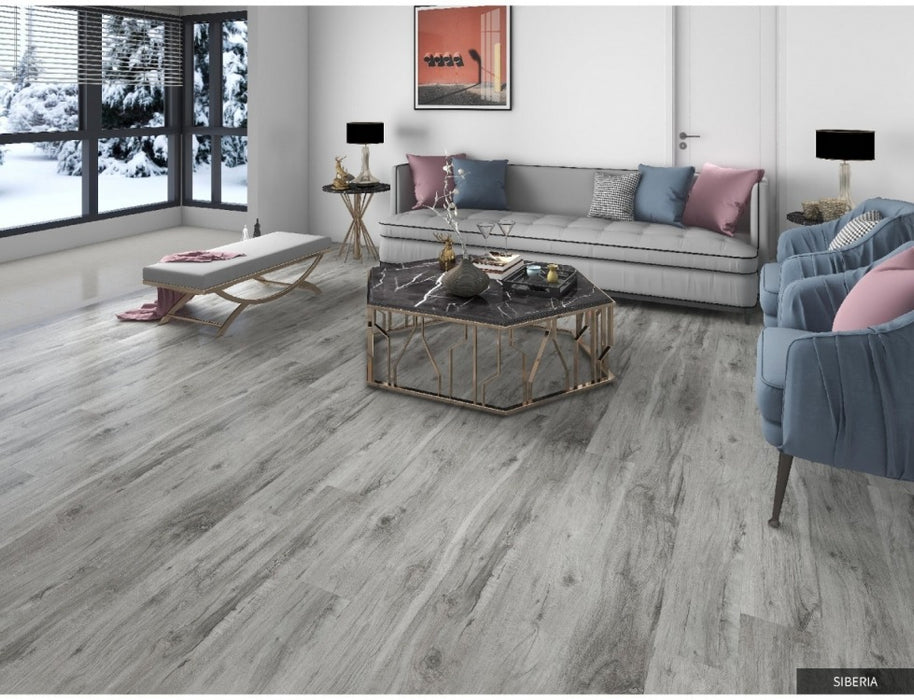 NAF AquaPlus Gold with Cork Siberia 7mm waterproof SPC vinyl plank flooring with textured wood grain and attached cork backing in a living room