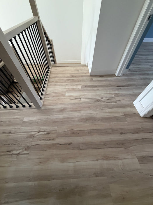 NAF AquaPlus Gold Lakeshore 7mm waterproof rigid core vinyl plank flooring with realistic wood grain and deep-textured finish applied at home