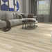 NAF AquaPlus Gold Lakeshore 7mm waterproof rigid core vinyl plank flooring with realistic wood grain and deep-textured finish in a living room