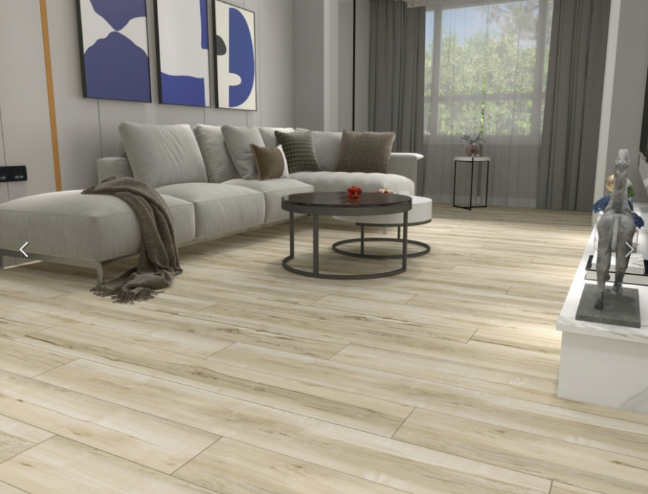 NAF AquaPlus Gold Lakeshore 7mm waterproof rigid core vinyl plank flooring with realistic wood grain and deep-textured finish in a living room