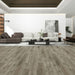 NAF AquaPlus Gold Leslie 7mm waterproof rigid core vinyl plank flooring with realistic wood grain and deep-textured finish in a living room