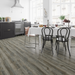 NAF AquaPlus Gold Rosedale 7mm waterproof rigid core vinyl plank flooring with realistic wood grain and deep-textured finish in a dining room