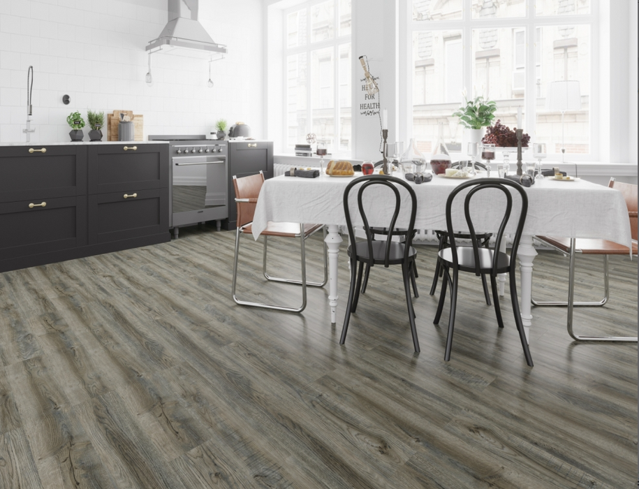 NAF AquaPlus Gold Rosedale 7mm waterproof rigid core vinyl plank flooring with realistic wood grain and deep-textured finish in a dining room